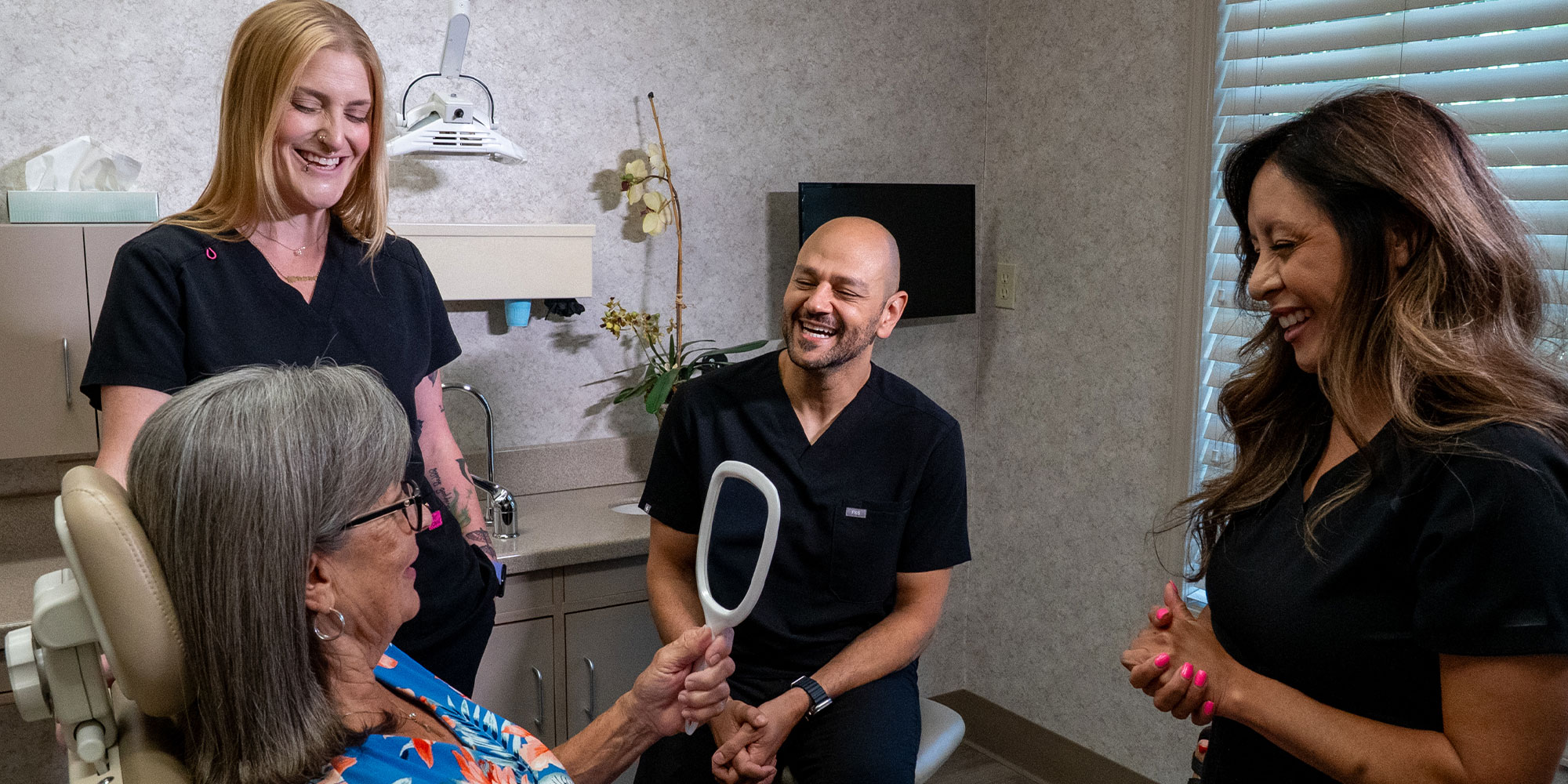 Paitent SMiling into a mirror