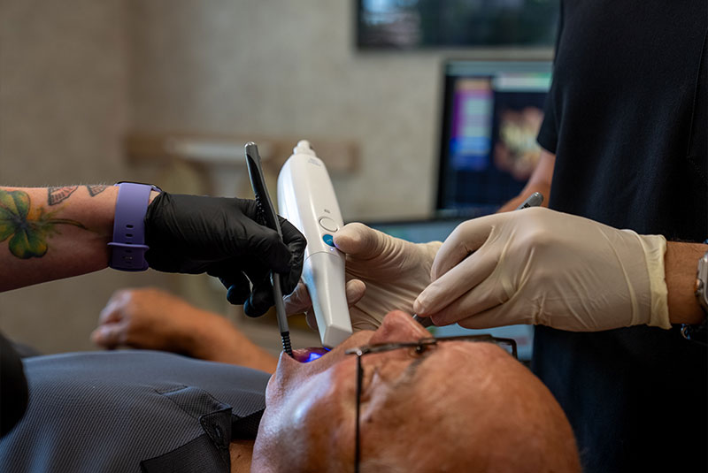 Doctor taking a 3d scan of Patients teeth