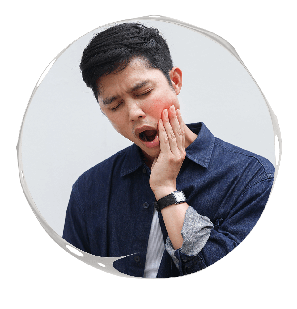 man holding jaw in pain due to tmj
