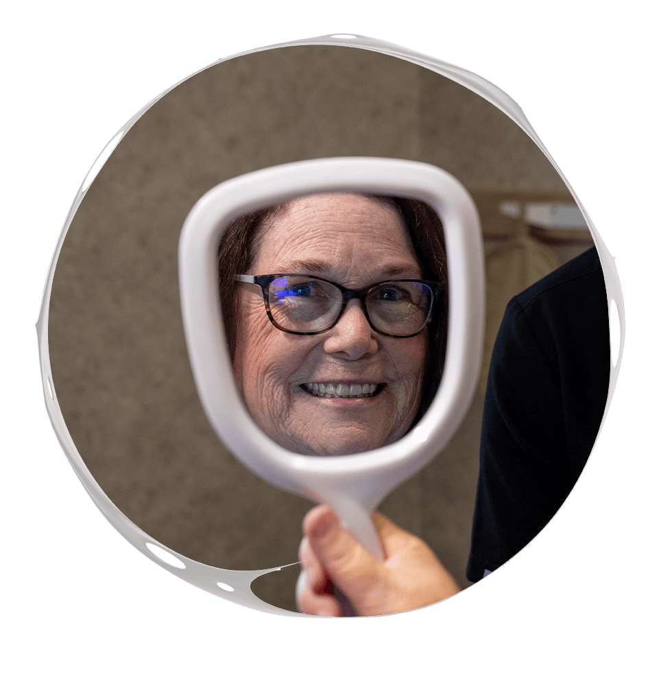 Woman looking into mirror