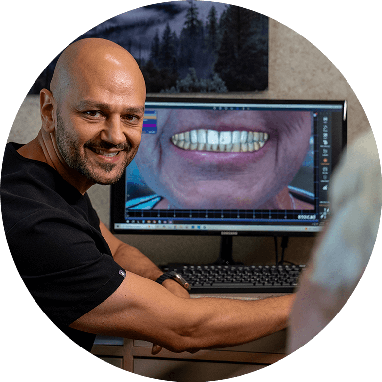 doctor going over 3d scan of patients teeth with the patient