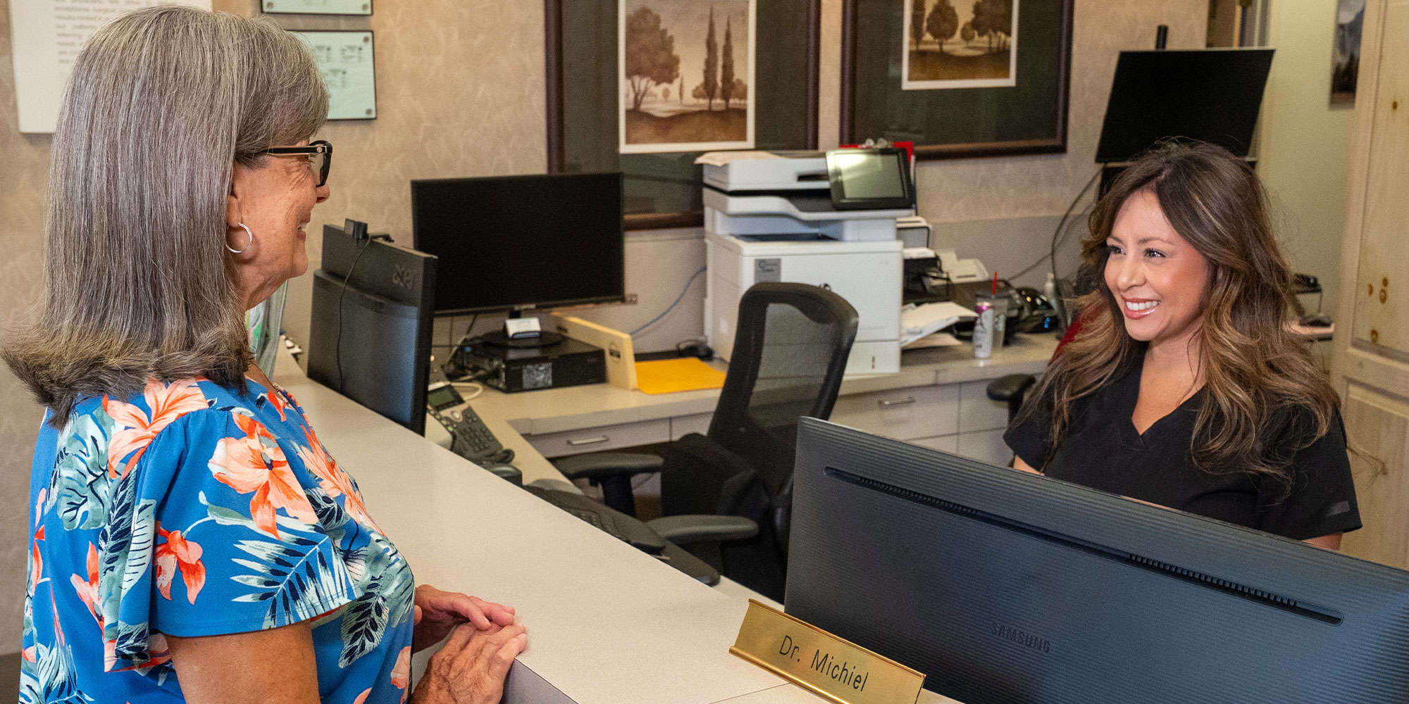 Team member going over insurance options with patient