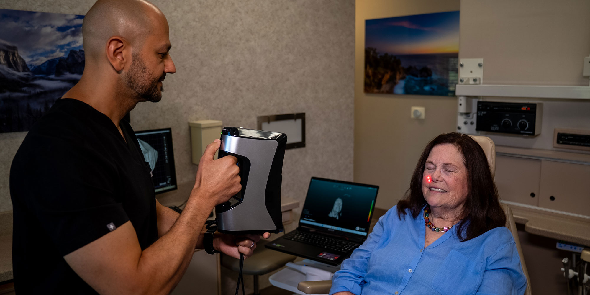 Doctor taking a 3d scan of Patient face and teeth